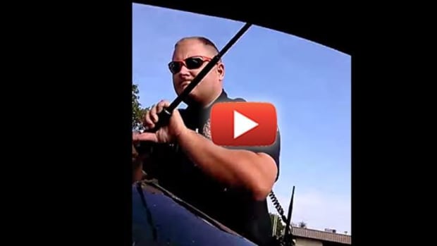 Cop-Smashes-Man's-Window-Pulls-Him-from-the-Car-for-Refusing-to-Show-Driver's-License