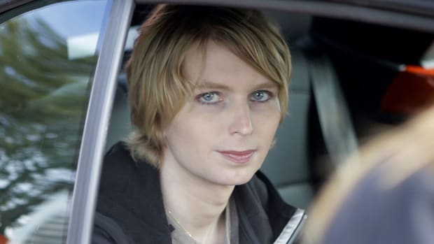 Chelsea Manning seated in the back of a police car September 17, 2017 | Steven Senne/AP