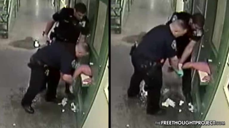 Cops Suspended After Video Shows Them Beat Man's Arm Through a Cell Door