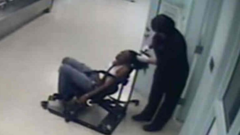 Cop Fired For Forcefully Cutting Off Restrained Woman's Hair, Gets Job Back with Back Pay