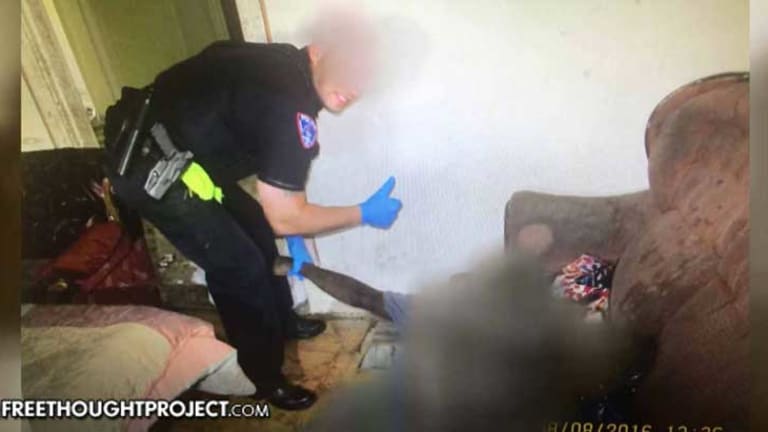 Disgusting Leaked Photo Shows a Cop Making Fun and Posing With a Mother's Dead Son