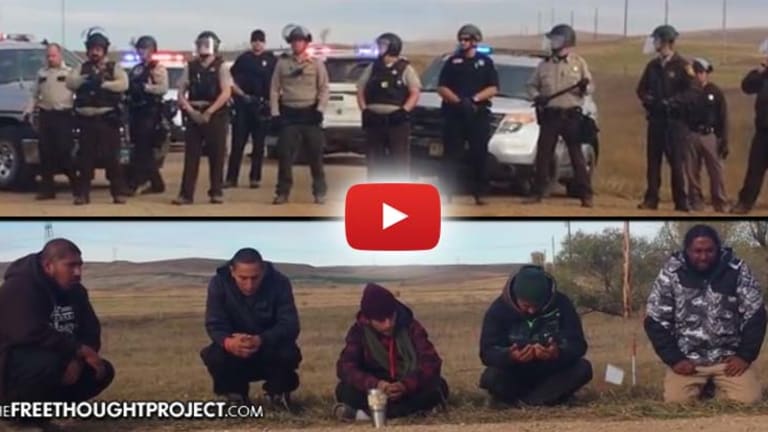 Video: 40 Cops With Riot Gear, Armored Vehicle and LRAD Swarm 5 Praying Native Americans at DAPL