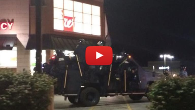 Ferguson riots: Clashes, looting in Missouri following vigil for teen shot dead by police