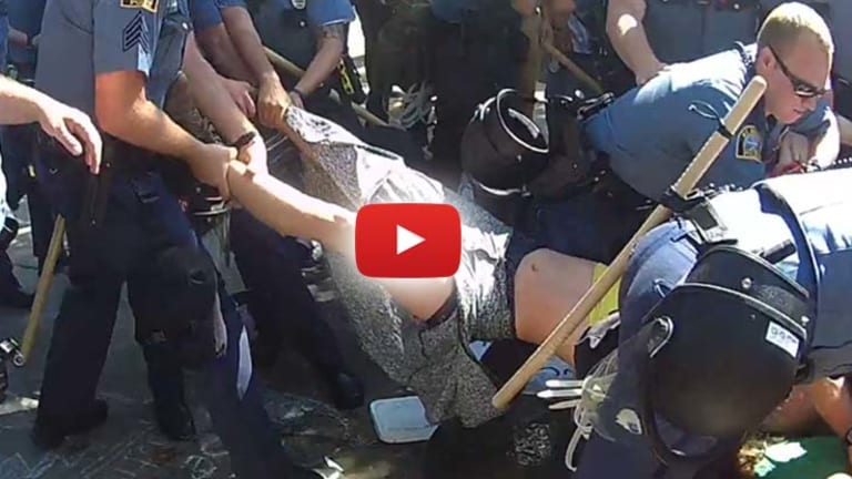 Video: Cops Drag Woman Away by Her Legs for Peacefully Protesting Police Brutality