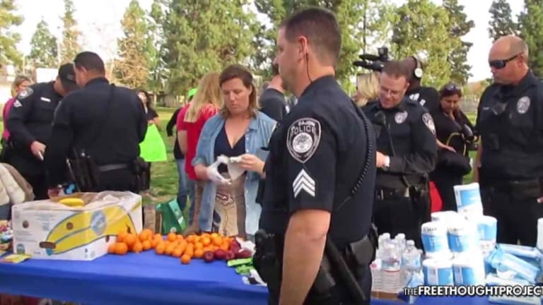 WATCH: Cops Raid Park, Arrest a Dozen People, Including a Child—For Helping the Homeless