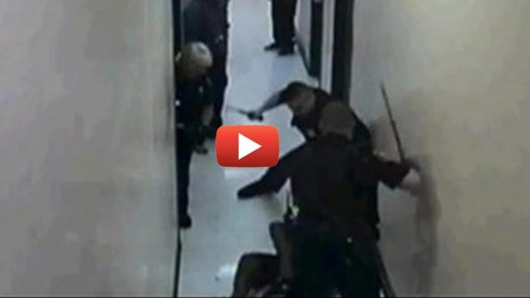 VIDEO: Man Attacked by Two Police Officers While Standing in Hallway