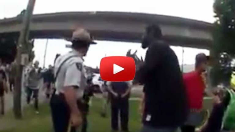 As Crowd of Teens Jaywalks, Cops Single Out the Only Black Guy -- But His Friends Had His Back
