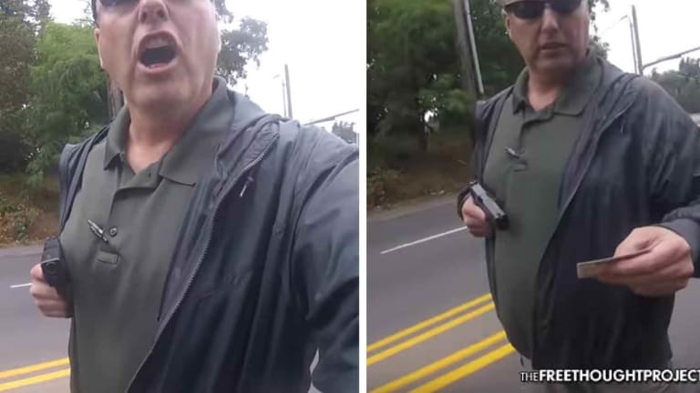 WATCH: Insane Cop Holds Innocent Man at Gunpoint, Illegally Searches Him and Is NOT FIRED