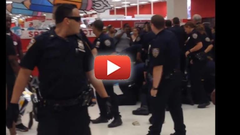 VIDEO: Crowd Becomes Angry as they Watch Swarms of Cops Jump on One Man in a Target Store