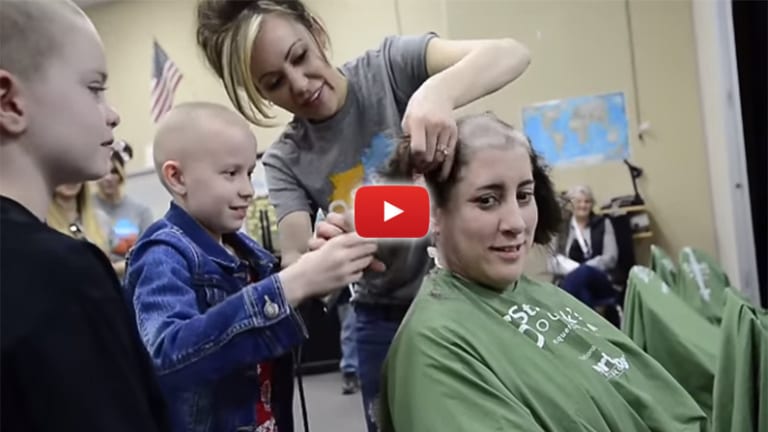 Watch: 80 Students & Teachers Shave their Heads to Support Classmate with Cancer