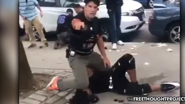 WATCH: Cop Points Gun at Concerned Citizens for Begging Him to "Calm Down"