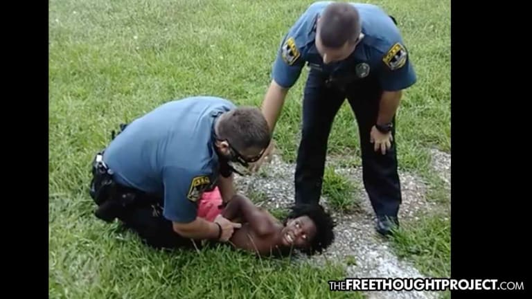Cops Investigated As Video Shows Police Pin Tiny Boy to the Ground for Trying to Protect His Dad