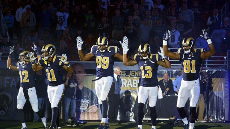 Rams Players Make Bold Political Statement by Entering Field With “Hands Up, Don’t Shoot” Pose
