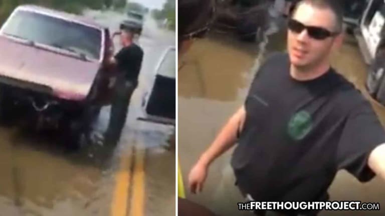 Cop Caught on Video Harassing, Fining Flood Victims for Trying to Help Each Other
