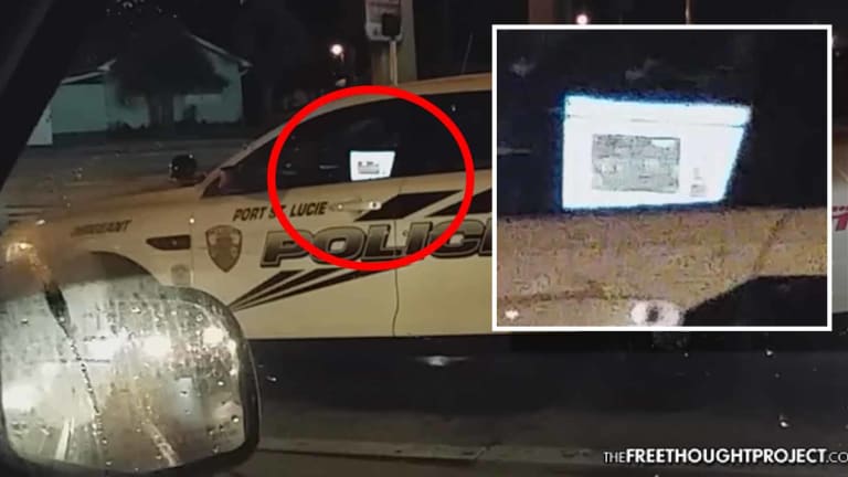 WATCH: Cop Caught Driving While Watching a Football Game on His Laptop