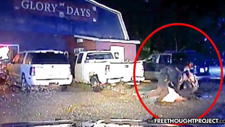 WATCH: Cops Mistake Innocent Man for Suspect, Drag Him From Truck, Beat Him to a Pulp