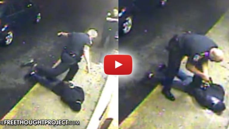 Disturbing Video Catches Cop Severely Beat Restrained Man & Threaten Him With Gun to His Head