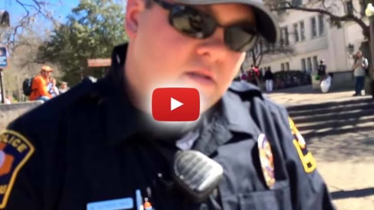 Watch Free Speech Die: Cop Tickets Man Because It's Now "Illegal to Offend Someone"