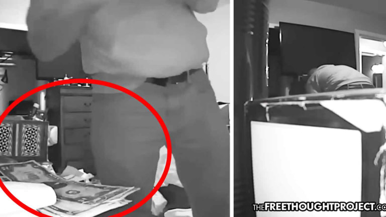 WATCH: Cop Clearly Caught Taking Man's Cash, Stuffing It into His Sock—NO CHARGES
