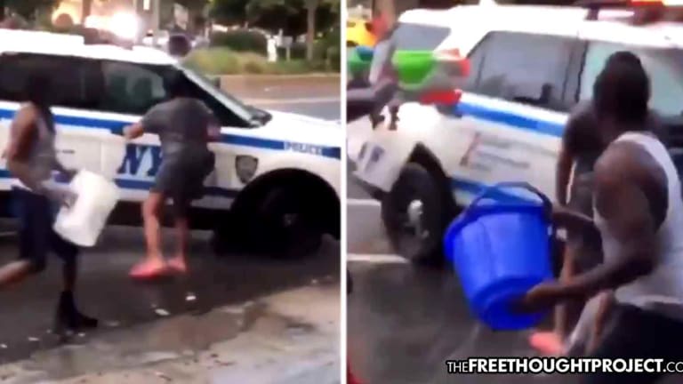 WATCH: Cops Ignore Woman Begging for Help As a Dozen Men Harass and Dump Water on Her
