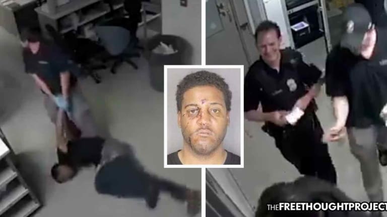 WATCH: Fellow Cops Laugh as Officer Cuts Handcuffed Man's Face Open, Drags Him Down the Hall