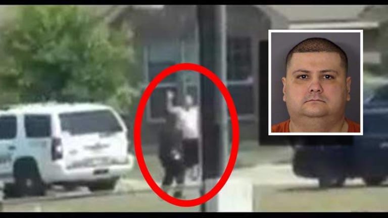 Newly Released Graphic Video Shows Cops Killing Unarmed Man With His Hands Up from Far Away