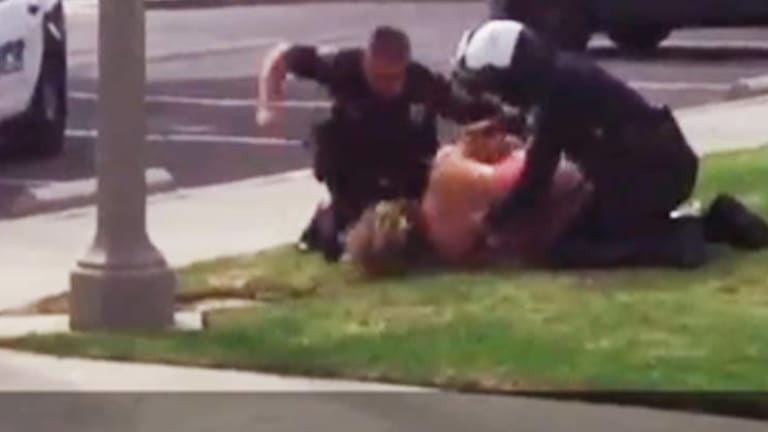 VIDEO: Innocent Mother Beaten by Cops in Front of Her Children for Reporting Cop's Rude Behavior