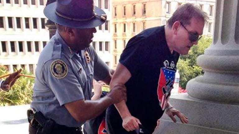 The Reason this Black Cop is Grabbing a White Man Wearing a Swastika Will Make Your Day