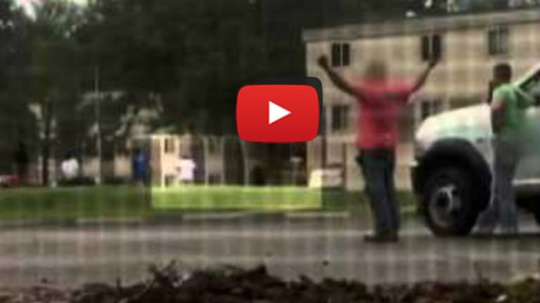 'He had his f**king hands in the air!' New footage shows Ferguson witnesses reacting to teen's death