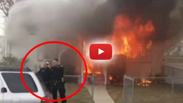 Neighbors Furious After Video Shows Cops Take Laughing Selfie in Front of a Burning Home
