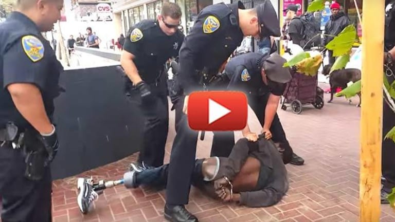 Video Catches 14 Cops Gang Up on Homeless Amputee 'Armed' with Crutches