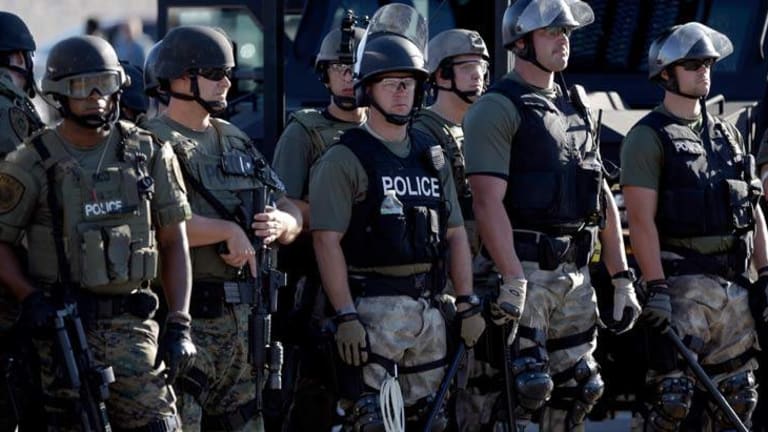Ferguson Cops Caught in Racist Email Scandal: Called Obama "Chimpanzee" & Black People Dogs