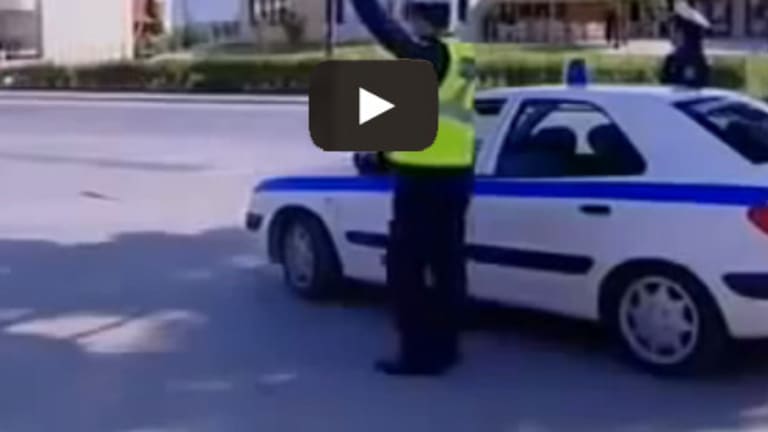 Police man puts his hand up to slow down biker, but instead...