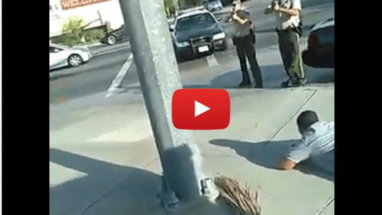 Dramatic Video Shows Man Refusing to Lie Down For Police, Despite Guns Pointed at Him