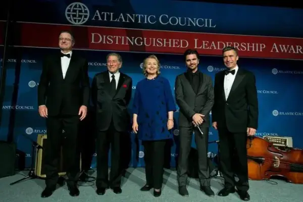 Hillary “the hawk” Clinton at 2013 Atlantic Council awards ceremony. [Source: mronline.org]