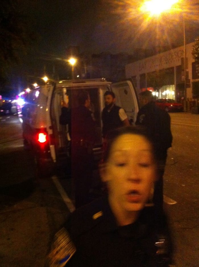 Officer Durkin, in the foreground, is telling Ben that he cannot take this photo. . According to Attorney Krages, you are allowed to take photos in public places. https://www.krages.com/ThePhotographersRight.pdf . Officer Durkin’s reprimand is in violation of Ben’s rights.
