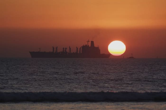 A US Navy warship refuelling off the coast of California. Jason Orender/Shutterstock