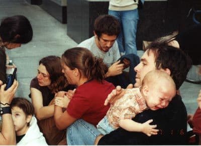 Don Joughin comforts his eleven-month-old son after the infant was doused in pepper spray by one of Portland’s “Finest.”