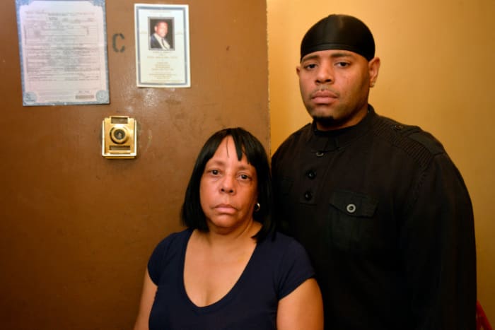 The family of the deceased James Jordan Sr., widow Karen and son James Jordan Jr., have resorted to leaving a copy of Jordan Sr.'s death certificate on their door to stop NYPD raids. Photo: Paul Martinka