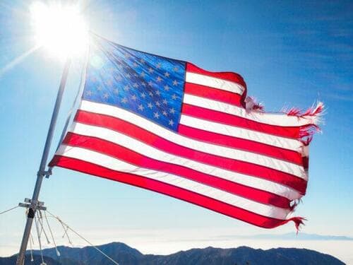 An American flag waves in the wind on top of Mt. Baldy, in Los Angeles County, on Oct. 21, 2011. (John Fredricks/The Epoch Times)