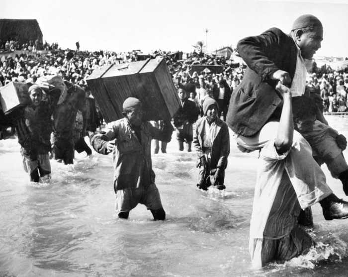 Palestine refugees initially displaced to Gaza board boats to Lebanon or Egypt, in 1949. Credit: Hrant Nakashian/1949 UN Archives — Source: Haaretz
