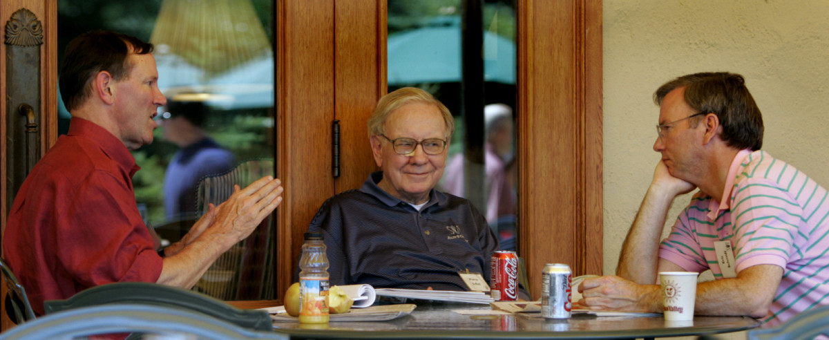 The Washington Post's Don Graham, left, Berkshire Hathaway's Warren Buffett and Google's Eric Schmidt, right, chat during the annual Allen and Co.'s conference, July 7, 2005, in Sun Valley, Idaho. (AP/Douglas C. Pizac)
