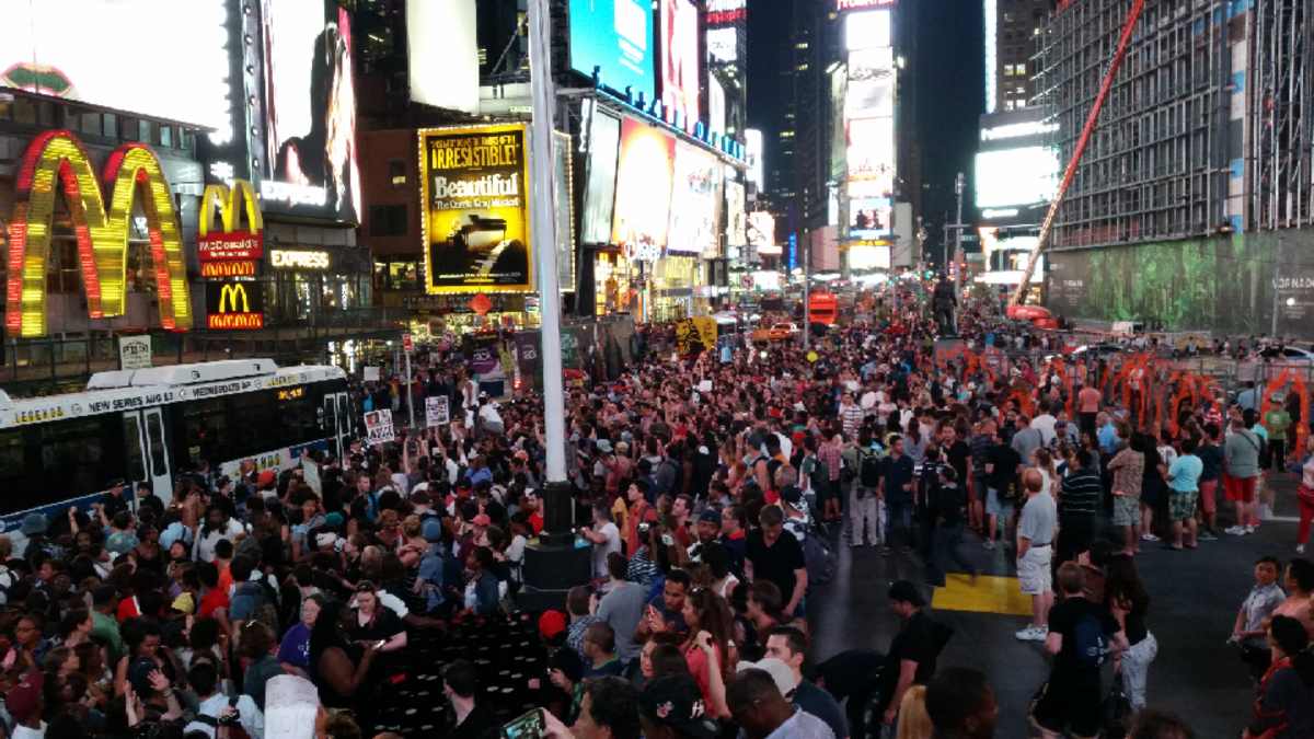 Thousands gather in NYC voice their opposition to police tactics in Ferguson.