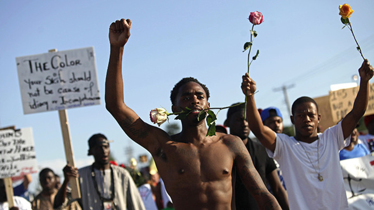 Demonstrators protest against the fatal shooting of Michael Brown in Ferguson (Reuters / Joshua Lott)