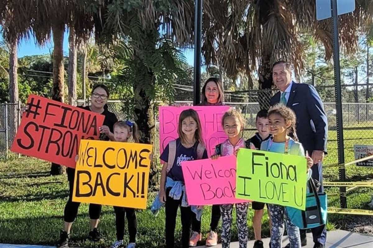 Fiona LaShells stands with family, friends and state Rep. Mike Caruso, R-Boca Raton, outside of Discovery Key Elementary on Monday, Nov. 8.