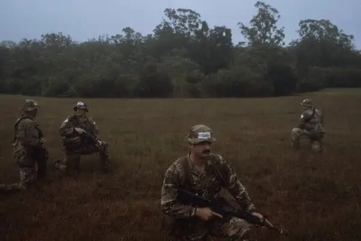 Soldiers practicing tactical movements in the pouring rain. [Source: nytimes.com]