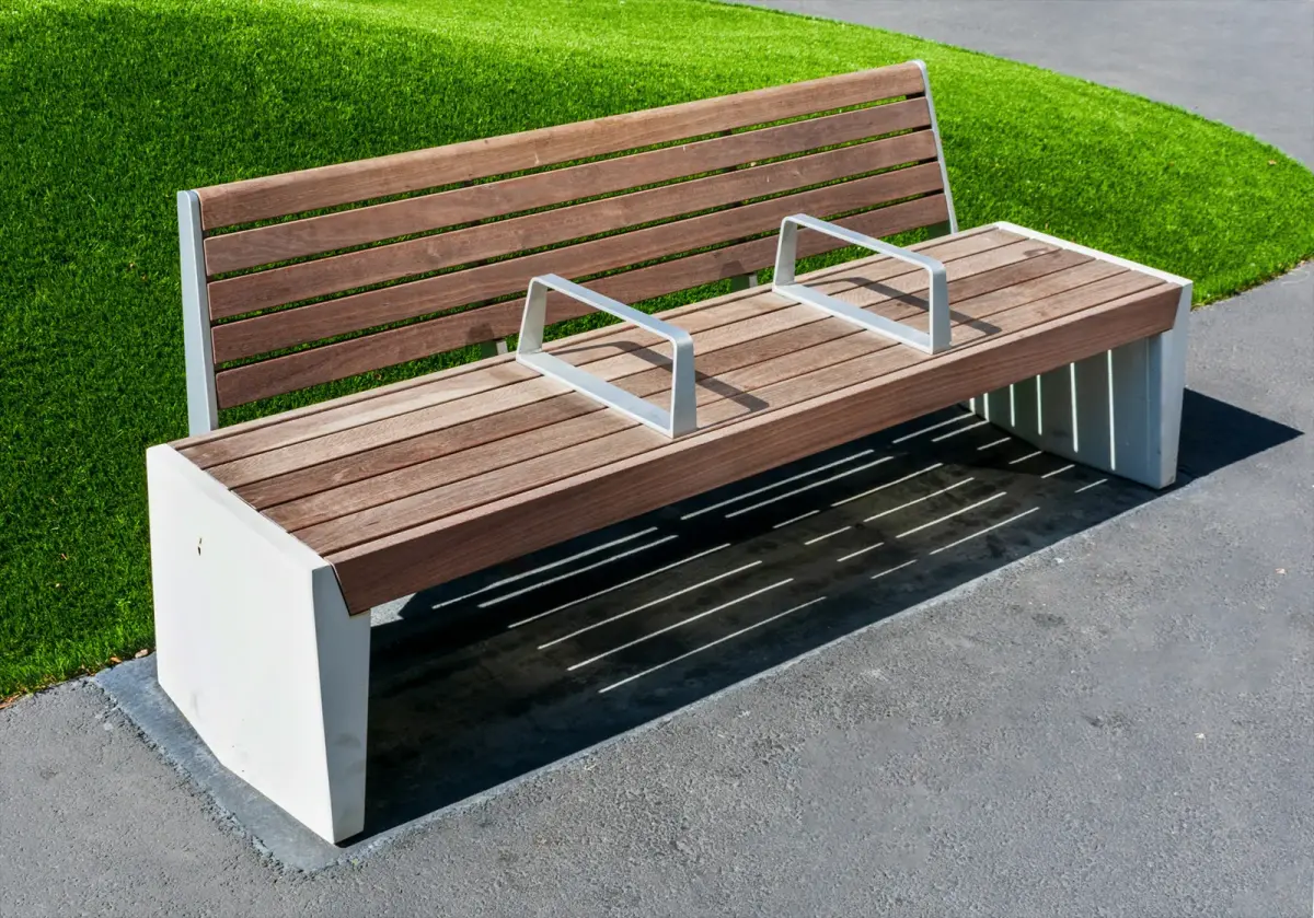 Unnecessary armrests installed on a bench to prevent laying down.