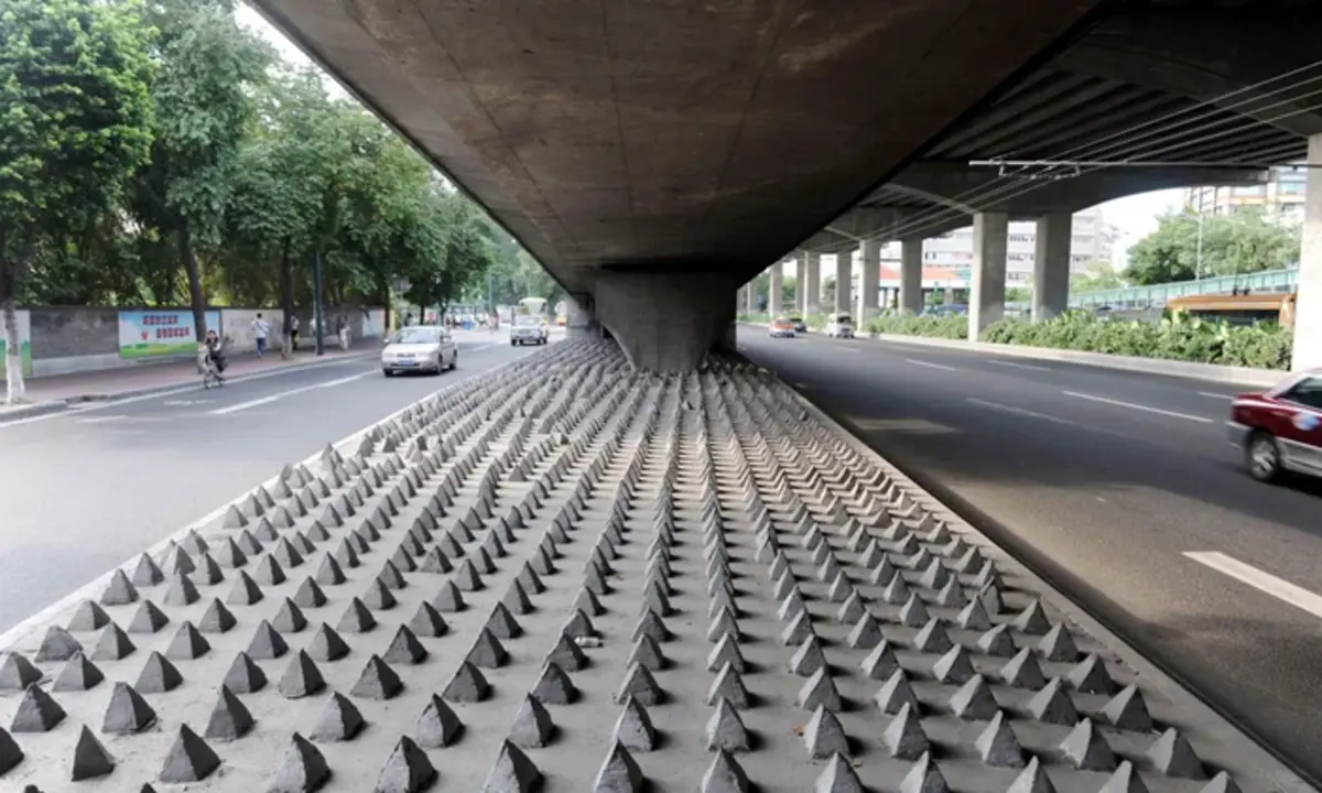 Spikes installed under a bridge to prevent homeless camping.